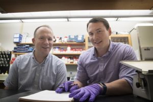 Jason Papin (left) and Greg Medlock have developed an important new resource for explorers of the microbiome.