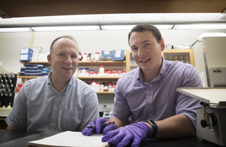 Jason Papin (left) and Greg Medlock have developed an important new resource for explorers of the microbiome.
