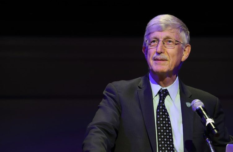Francis Collins speaks at a microphone.
