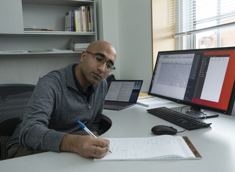 Askrosh Ratan works at his desk.