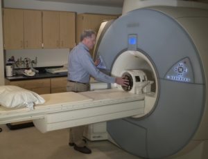 John Mugler uses an MRI