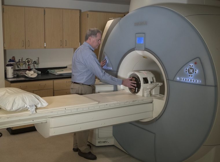 John Mugler uses an MRI