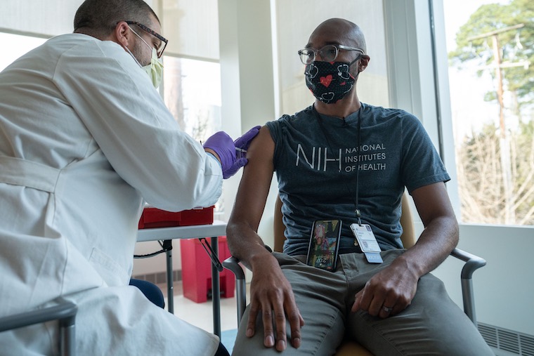 Dr. Taison Bell receives a COVID-19 vaccine at UVA Health.