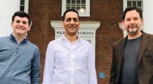 Eric Wengert, Manoj Patel and Ian Wenker pose outside the old medical school building at UVA Health.