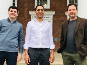 Eric Wengert, Manoj Patel and Ian Wenker pose outside a red brick building at UVA Health.