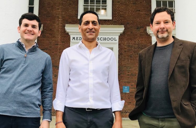 Eric Wengert, Manoj Patel and Ian Wenker pose outside a red brick building at UVA Health.