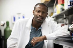 Ukpong B. Eyo leans on a bench in his lab.