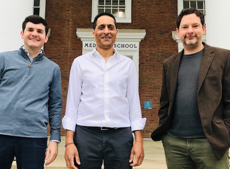 ric Wengert, Manoj Patel and Ian Wenker stand outside a red brick building at UVA.