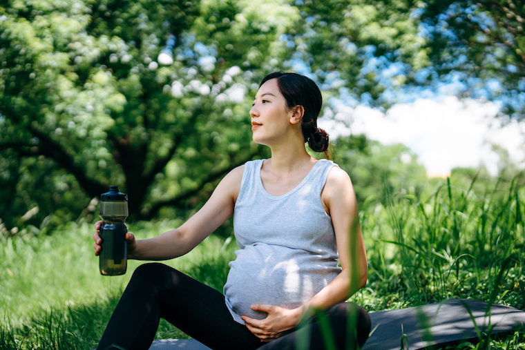 Pregnant woman outdoors