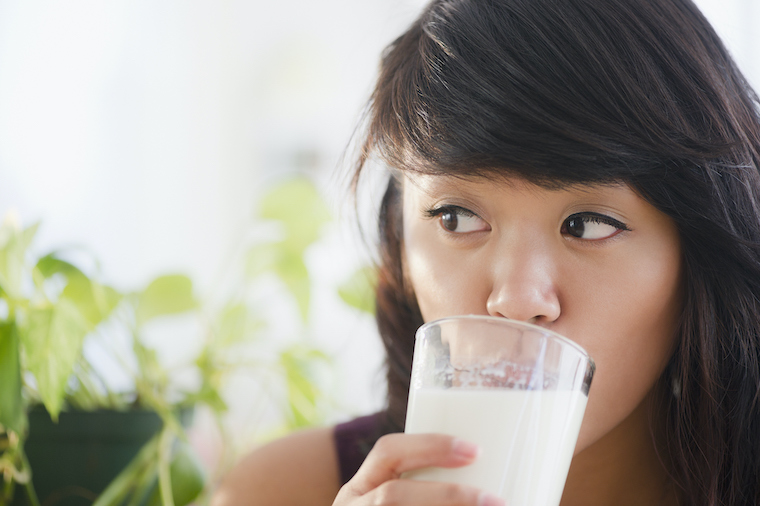 Woman drinks milk