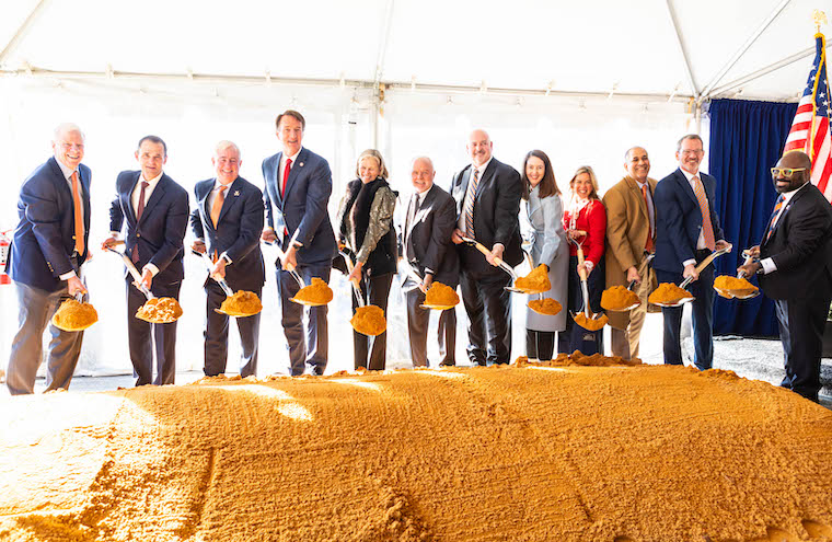 UVA and state leaders, as well as donor Paul Manning, use shovels in a symbolic groundbreaking.