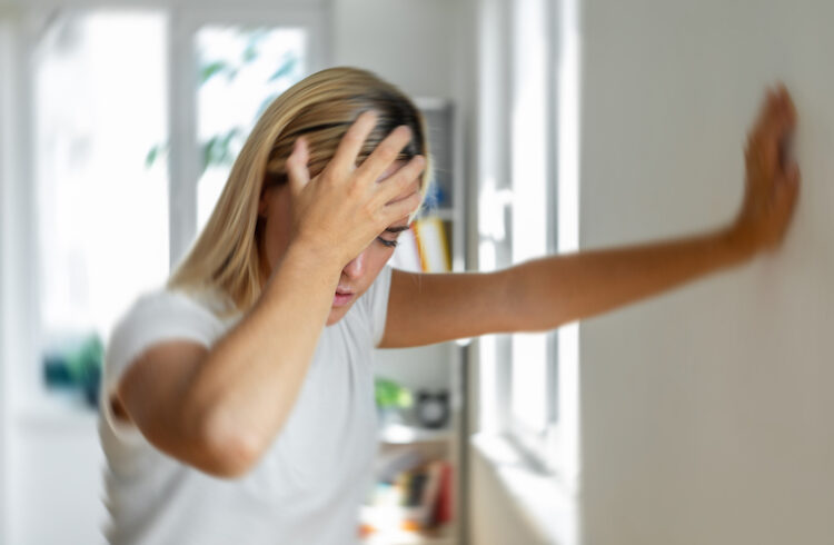 Woman stricken by migraine