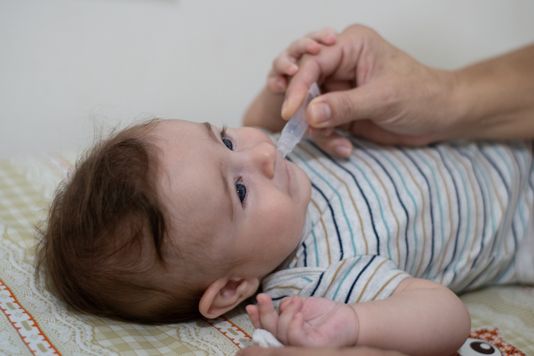 Baby takes rotavirus vaccine
