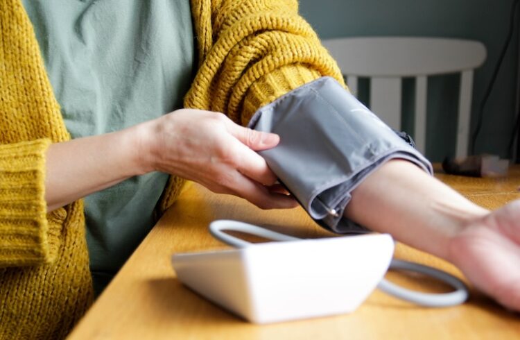 Woman checking blood pressure