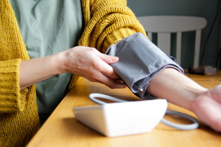 Woman checking blood pressure