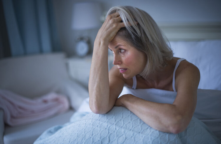 Woman unable to sleep in bed