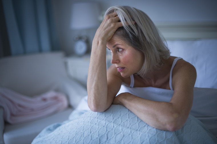 Woman unable to sleep in bed