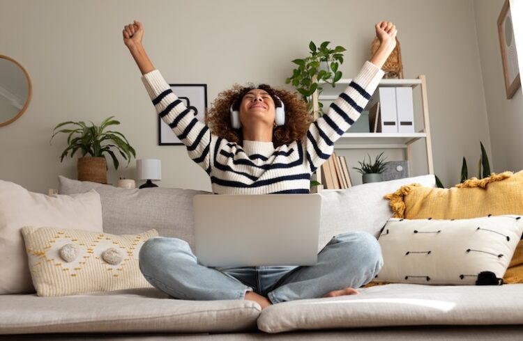 Woman exults on a couch