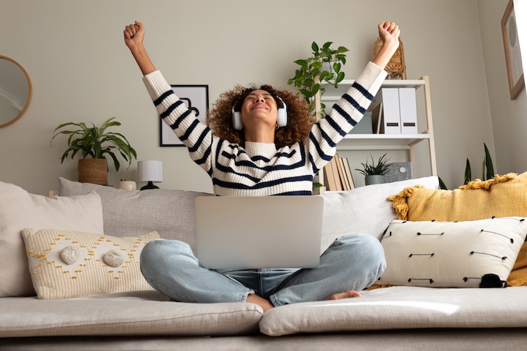 Woman exults on a couch