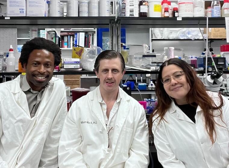 Researchers Ukpong Eyo, William Mills III and Aida Lopez in the lab