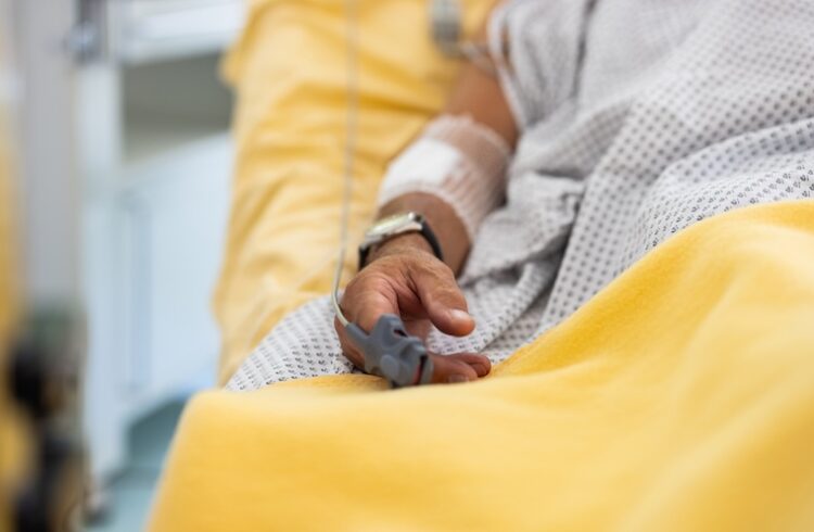 Male patient in a hospital bed