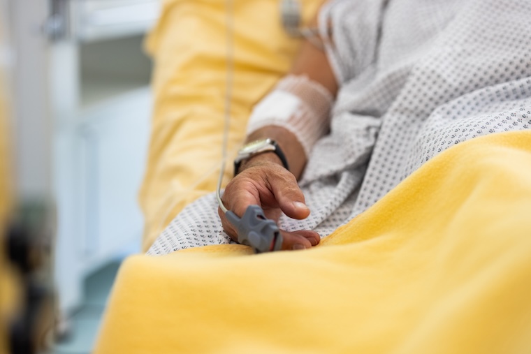 Male patient in a hospital bed