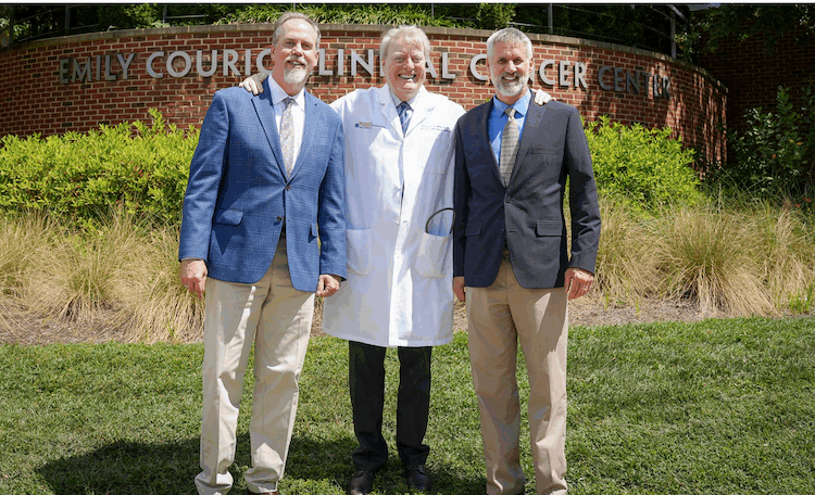 Charles Chalfant, Thomas P. Loughran Jr. and David Feith outside the Emily Couric Clinical Cancer Center.