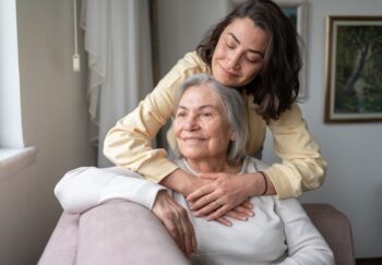 A daughter hugs her mother