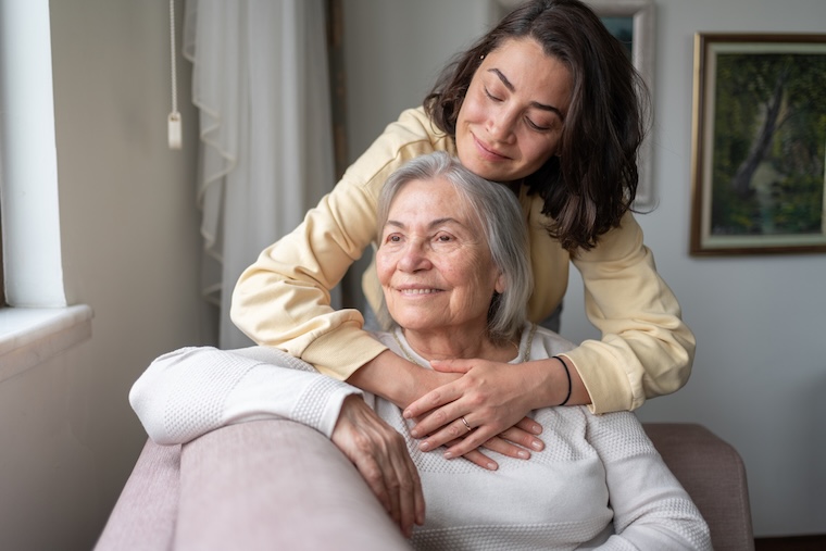 A daughter hugs her mother